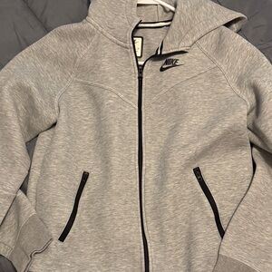 Nike Kids Light Gray Zip-Up Jacket fits like a women’s xs